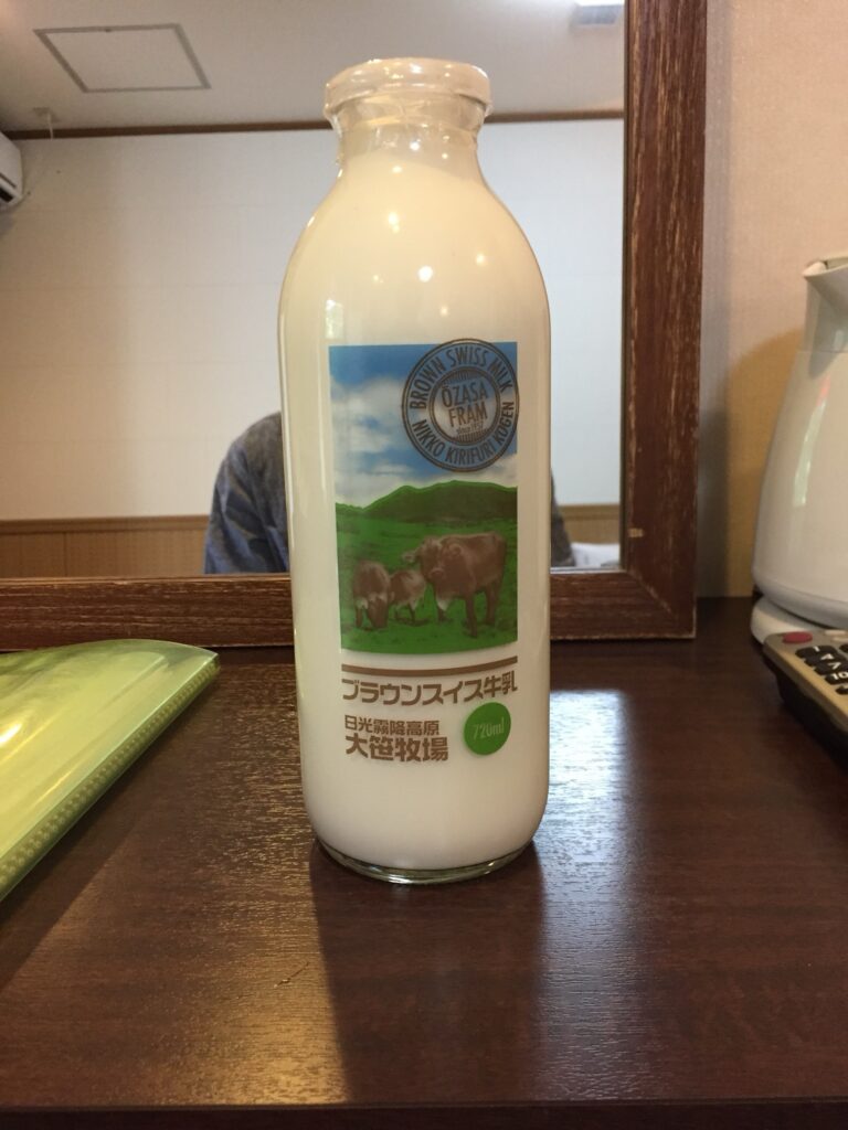 Glass of Brown Swiss cow milk rich in protein and calcium, known for its creamy texture and high nutritional value